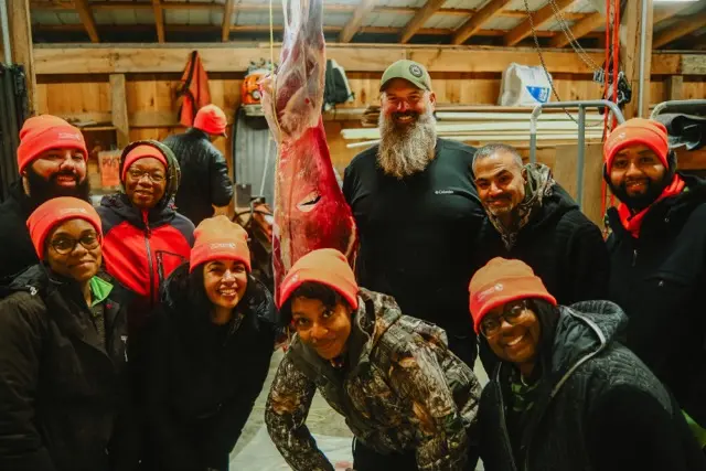 HOC members around a deer that was hunted.