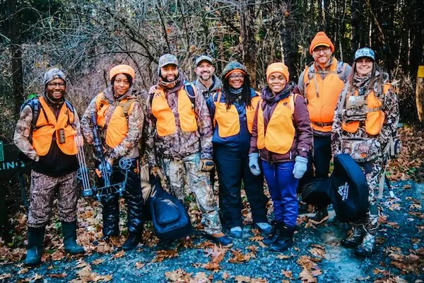 HOC group picture wearing camo.